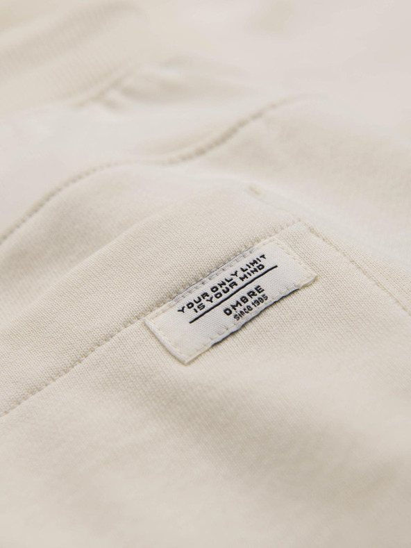 Ombre Clothing Moške trenirke BASIC z rebrasto nogavico - smetanaste V11 OM-PABS-0305 Ombre Clothing